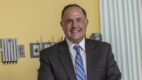 Dr. Jason Mouzakes, Albany Medical Center Hospital General Director, standing in a hospital patient room.